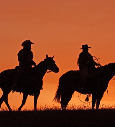 Silhouettes of cowboys on horseback at sunset, Source: Photodune.net
