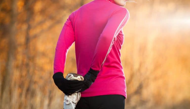 Young woman stretching before her run outdoors on a cold fall/winter morning, Source: Photodune.net