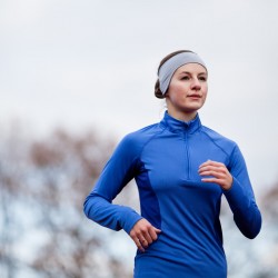 Portrait of a woman running against against blue sky, Source: Photodune.net