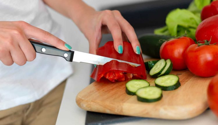 Young Woman Cooking in the kitchen, Source: Photodune