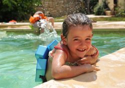 pool safety Pool safety: Smiling little girl in a swimming pool, Source: Photodune.net pool safety