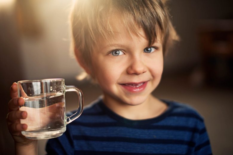 ways to get your kids to drink more water Ways to get your kids to drink more water: A boy and his water, Source: iStockPhoto via Amelia Johnson ways to get your kids to drink more water
