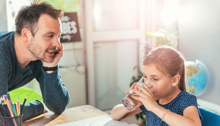 Father and daughter and drinking water, Source: iStockPhoto via Amelia Johnson