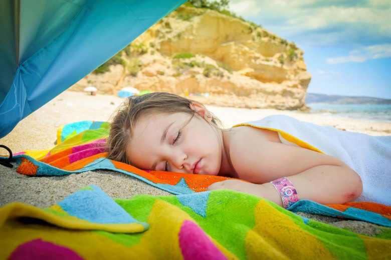 Girl sleeping on a beach, Source: Pixabay