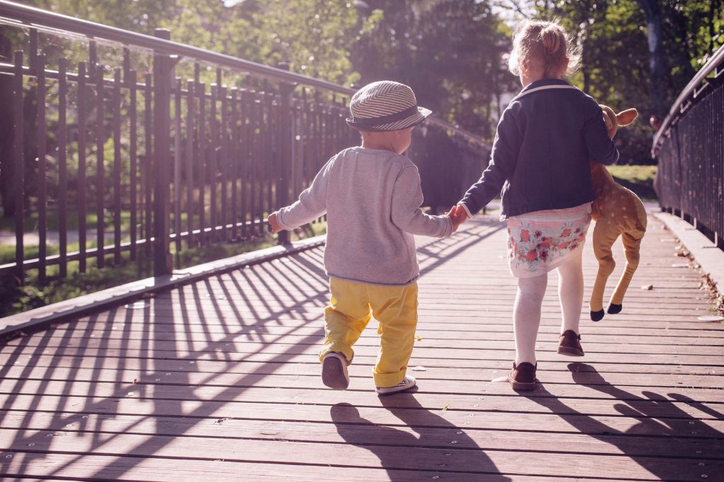Toddler boy and his sister on a bridge, Source: Stocksnap.io