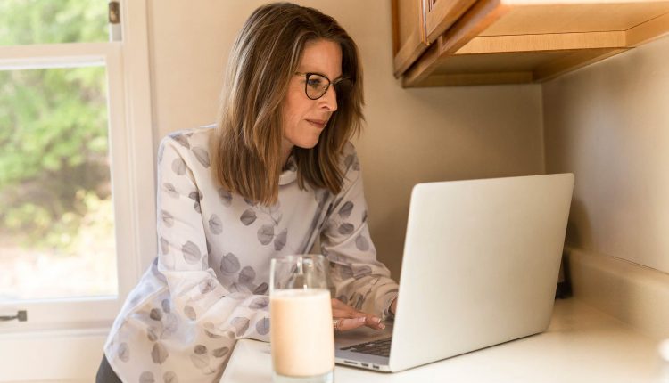 In the kitchen with milk and a laptop, Source: Stocksnap